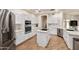 Kitchen with white cabinetry, stainless steel appliances, and a center island at 760 N Ithica St, Gilbert, AZ 85233