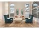 Bright living room with cathedral ceilings and large windows looking out to the yard at 760 N Ithica St, Gilbert, AZ 85233