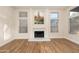 Bright living room showcasing a sleek fireplace with a contemporary painting above it at 760 N Ithica St, Gilbert, AZ 85233