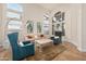 Bright living room with cathedral ceilings and large windows looking out to the yard at 760 N Ithica St, Gilbert, AZ 85233