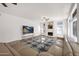 Spacious living room with a fireplace, large TV, and modern furnishings at 760 N Ithica St, Gilbert, AZ 85233