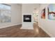 Living room showcasing a sleek fireplace and bright natural light at 760 N Ithica St, Gilbert, AZ 85233