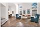 Bright living room with cathedral ceilings and large windows looking out to the yard at 760 N Ithica St, Gilbert, AZ 85233