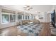 Bright and spacious living room with large windows overlooking the pool area at 760 N Ithica St, Gilbert, AZ 85233