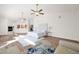 Spacious main bedroom featuring hardwood floors, fireplace, and ceiling fans at 760 N Ithica St, Gilbert, AZ 85233