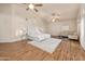 Spacious main bedroom featuring hardwood floors, ceiling fans, and sitting area at 760 N Ithica St, Gilbert, AZ 85233