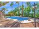 An inviting pool area with mature landscaping, rock features and wrought iron fencing at 760 N Ithica St, Gilbert, AZ 85233
