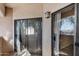 The sliding glass doors from the balcony let light in the home at 10030 W Indian School Rd # 218, Phoenix, AZ 85037