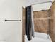 Full bathroom features a shower with a shower curtain and tile at 10030 W Indian School Rd # 218, Phoenix, AZ 85037