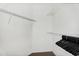 Walk-in closet with plenty of shelving and clothes hangers at 10030 W Indian School Rd # 218, Phoenix, AZ 85037