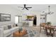 Inviting living room featuring contemporary furnishings, an open layout, and seamless flow to the kitchen and dining area at 10030 W Indian School Rd # 218, Phoenix, AZ 85037