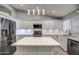 Updated kitchen featuring stainless steel appliances and white cabinetry at 12409 N 60Th Ln, Glendale, AZ 85304