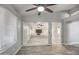 Spacious living room with wood-look floors and a fireplace at 12409 N 60Th Ln, Glendale, AZ 85304