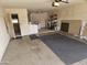Spacious garage featuring an attached storage area or workshop space, offering functionality and convenience at 10477 W Highwood Ln, Sun City, AZ 85373