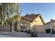 Charming home with a tile roof, desert landscaping, and mature tree for shade at 4537 E Shomi St, Phoenix, AZ 85044