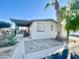 Charming single-story home with a covered porch and well-maintained landscaping at 9427 E University Dr # 100, Mesa, AZ 85207