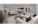 Open-concept living space with a modern kitchen, dining area, and large sliding doors to outdoor space at 11691 N Luckenbach St, Surprise, AZ 85388