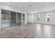 Open-concept living space with sliding glass doors leading to the outdoors and two windows for natural light at 11691 N Luckenbach St, Surprise, AZ 85388