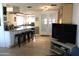 Bright living room featuring an open plan, hardwood floors, and access to a large kitchen at 14609 N Montego Ct, Phoenix, AZ 85053