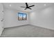Bright bedroom with ceiling fan and natural light from single hung window at 2126 E Watson Dr, Tempe, AZ 85283