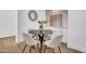 Cozy dining area with stylish decor and a decorative mirror, next to a serving buffet at 2126 E Watson Dr, Tempe, AZ 85283