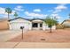 Charming home with desert landscaping, a two-car garage, and crisp white exterior at 2126 E Watson Dr, Tempe, AZ 85283