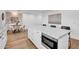 Open-concept kitchen features a large island with bar seating, modern appliances, and bright countertops at 2126 E Watson Dr, Tempe, AZ 85283