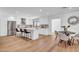 Spacious kitchen with stainless steel appliances, island seating, and an adjacent dining area at 2126 E Watson Dr, Tempe, AZ 85283