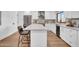 Beautiful modern kitchen with island seating, stainless steel appliances and white cabinetry at 2126 E Watson Dr, Tempe, AZ 85283