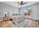 Serene main bedroom features paneled accent wall and access to the backyard patio at 2126 E Watson Dr, Tempe, AZ 85283
