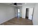 Bedroom with neutral walls, wood-look flooring, and ample closet space at 4442 E Aire Libre Ave, Phoenix, AZ 85032