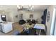 Open living space with modern furnishings, dining area, and seamless flow into the kitchen at 4442 E Aire Libre Ave, Phoenix, AZ 85032