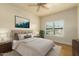Serene bedroom with a queen-size bed and natural light at 21320 N 56Th St # 2159, Phoenix, AZ 85054