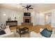Spacious living room featuring a fireplace and hardwood floors at 21320 N 56Th St # 2159, Phoenix, AZ 85054