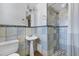Well-lit bathroom with vintage tile work and a glass-doored shower at 2246 W Mulberry Dr, Phoenix, AZ 85015