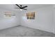 Spacious bedroom with carpet flooring and two windows at 2246 W Mulberry Dr, Phoenix, AZ 85015