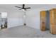 Carpeted bedroom with closet and bathroom access at 2246 W Mulberry Dr, Phoenix, AZ 85015