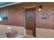 Close-up of home's front door, brick facade, and house number at 2246 W Mulberry Dr, Phoenix, AZ 85015