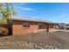 Brick home featuring desert landscaping with a rock drainage system, and a covered carport at 2246 W Mulberry Dr, Phoenix, AZ 85015