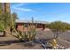 Charming brick home with low-maintenance desert landscaping and a unique cacti arrangement at 2246 W Mulberry Dr, Phoenix, AZ 85015