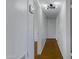 Clean hallway with white walls and retro lighting at 2246 W Mulberry Dr, Phoenix, AZ 85015