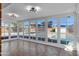 Bright sunroom featuring brick floors and views of the backyard pool at 2246 W Mulberry Dr, Phoenix, AZ 85015