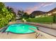 Sparkling blue pool with diving board, surrounded by landscaping at 7015 N Hillside Dr, Paradise Valley, AZ 85253