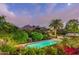 Inviting swimming pool surrounded by greenery and mountain backdrop at 7015 N Hillside Dr, Paradise Valley, AZ 85253