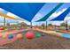 Shaded playground with colorful play equipment and soft ground cover at 5725 S 101St St, Mesa, AZ 85212