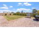 Backyard with a brick patio and green grass and grill at 28389 N 131St Dr, Peoria, AZ 85383