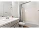 Cozy bathroom with a single vanity, combination tub and shower, and neutral color palette at 28389 N 131St Dr, Peoria, AZ 85383
