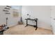 Bedroom with a black desk, black shelves and neutral colored carpet at 28389 N 131St Dr, Peoria, AZ 85383