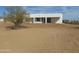 Modern home exterior showcasing clean lines, white facade, and desert landscaping at 31214 N 167Th Ave, Surprise, AZ 85387