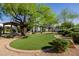 Lush backyard with an artificial lawn and a beautiful custom gazebo, ideal for outdoor enjoyment at 6620 E Stallion Rd, Paradise Valley, AZ 85253